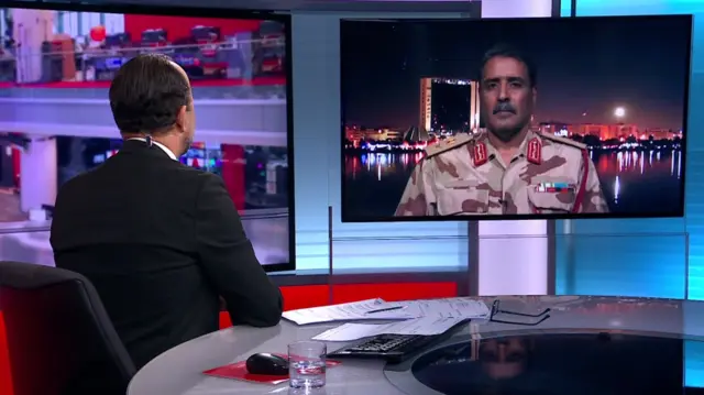 Ahmed al Masmari speaking on a video screen in the BBC Arabic studio