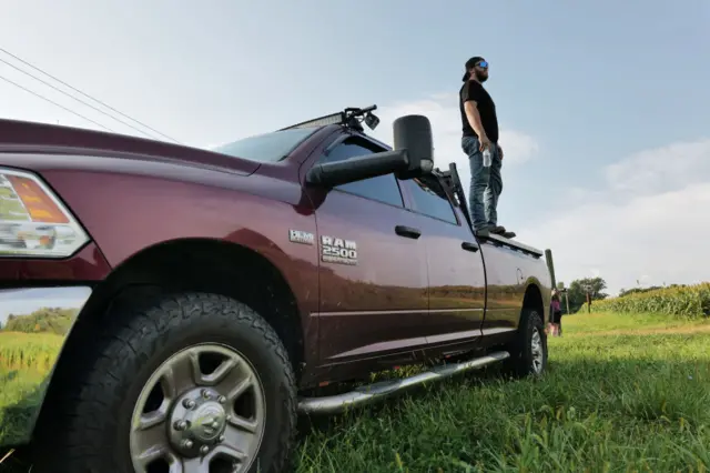 Mitch, a local resident, joins others in keeping watch over the fields on the perimeter of a search zone for an escaped prisoner on September 08, 2023 in Kennett Square, Pennsylvania