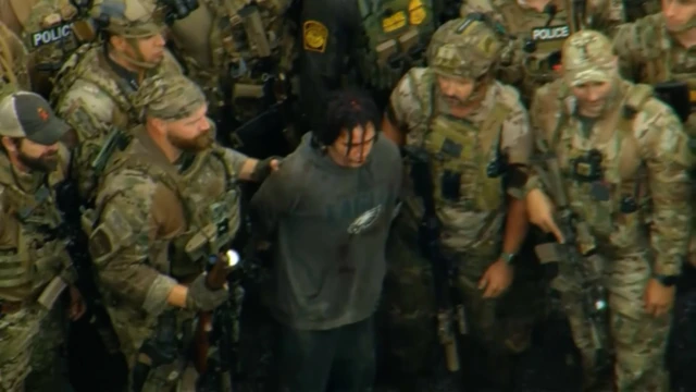 Cavalcante being arrested