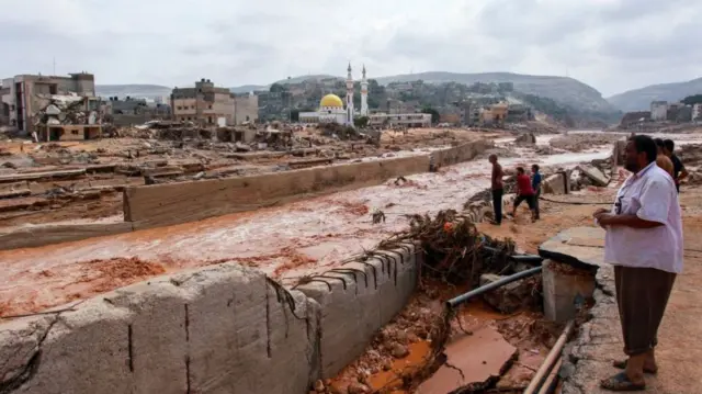 People look at the damage caused by floods in Derna, eastern Libya - 11 September 2023