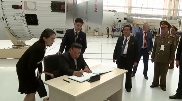 Kim Jong Un writes in the Vostochny Cosmodrome visitor book