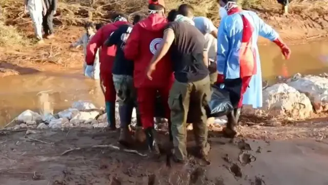 Libyan Red Crescent volunteers take part in a rescue operation in an unidentified location in Libya