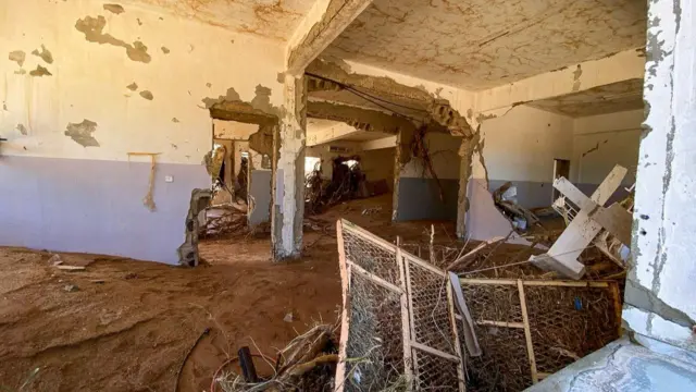 Inside a Derna school, thick mud on the ground and damaged walls.