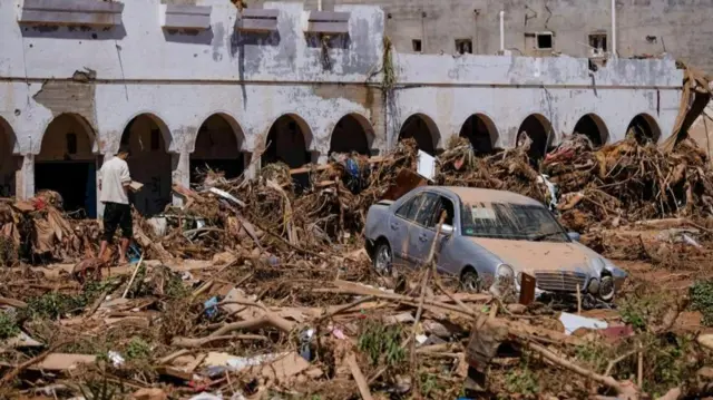 A view shows a damaged car, following a powerful storm and heavy rainfall hitting the country, in Derna, Libya