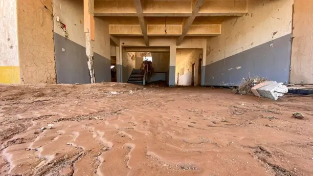 Inside a Derna school, thick mud on the ground and damaged walls.