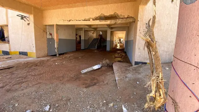 Inside a Derna school, thick mud on the ground and damaged walls.