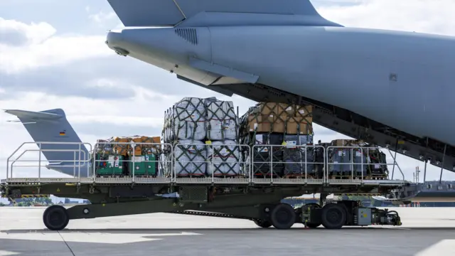 Two German armed forces transport planes loaded with technical relief supplies are pictured before flying to Libya