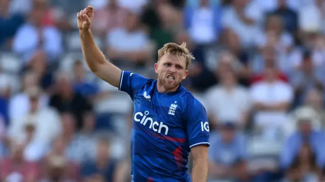 David Willey of England celebrates the wicket of New Zealand's Will Young