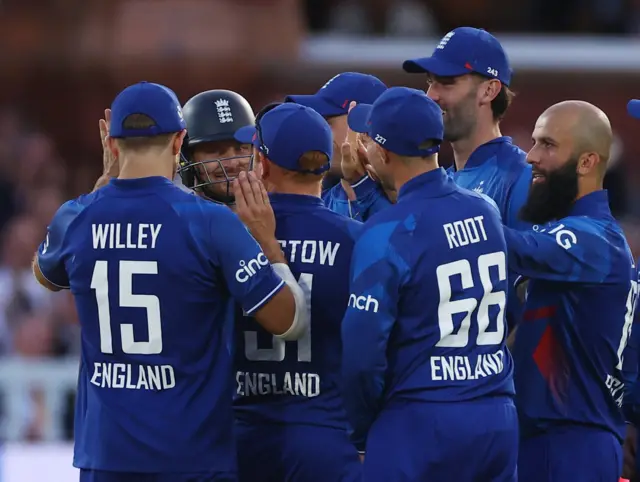 Moeen Ali and England celebrate the wicket of Henry Nicholls