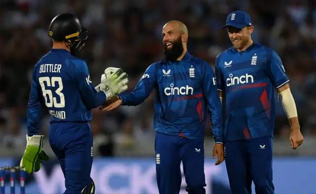 Moeen Ali celebrates a wicket with Jos Buttler