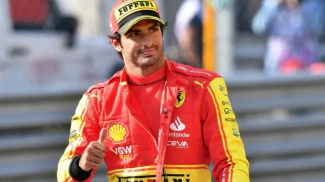 Carlos Sainz gives a thumbs up after securing pole at Monza