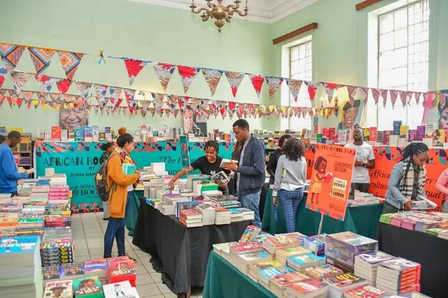 People browsing books at the book fair.