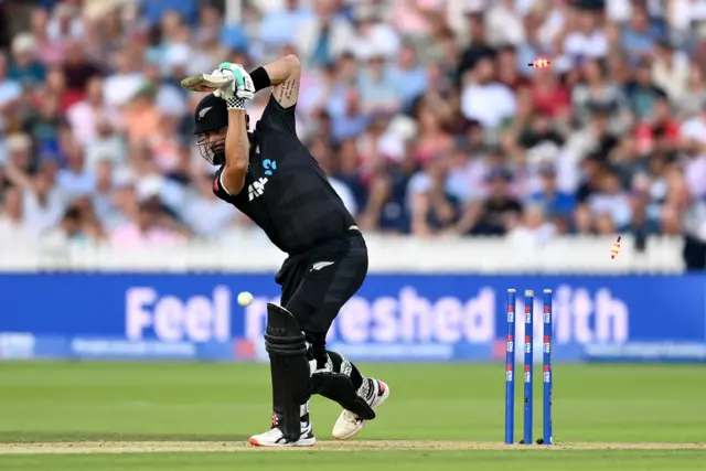 Daryl Mitchell is bowled by Brydon Carse