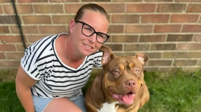 Charlotte Towner pictured with her XL bully Coco