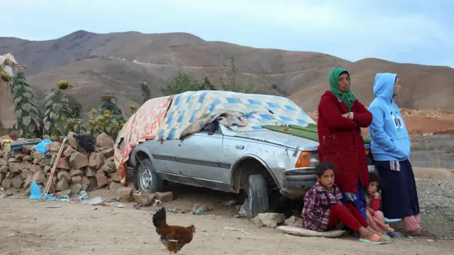 hadijia and her daughters Saeeda, 15, Fatima, 10, and Hanane, 6, pose outside of their damaged house in the aftermath of a deadly earthquake, in the rural village of Tagsdirt, Morocco September 14, 2023