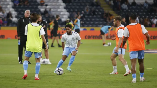 A photo of Coventry warming up before their football match against Hull