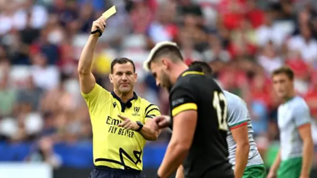 Johnny Williams shown yellow card