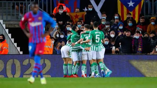 Real Betis players celebrate a goal against Barcelona in 2021`