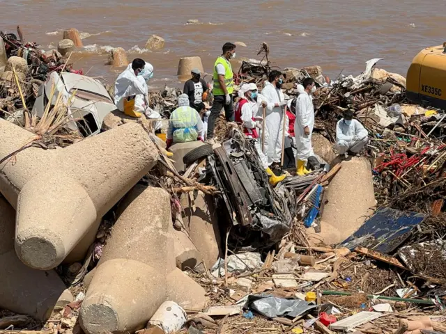 Rescuers looking for bodies near the sea in Derna