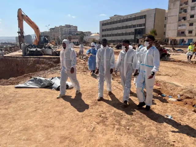 A group of rescuers looking for dead bodies in Libya