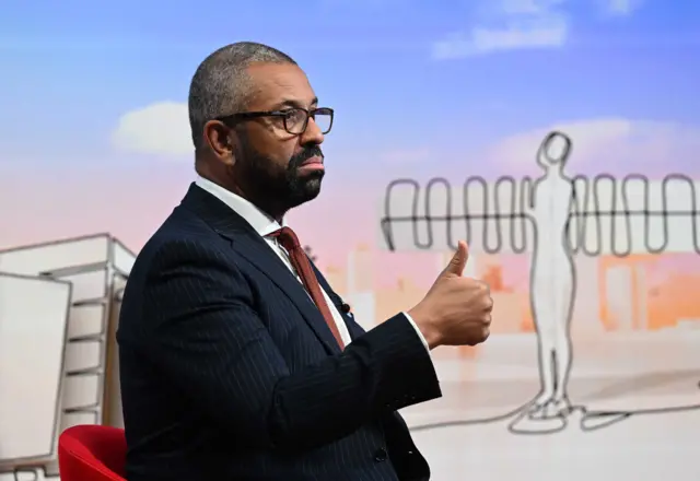 James Cleverly flashing a thumbs-up sign