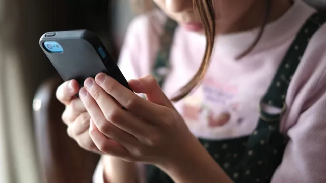 A girl looking at a phone