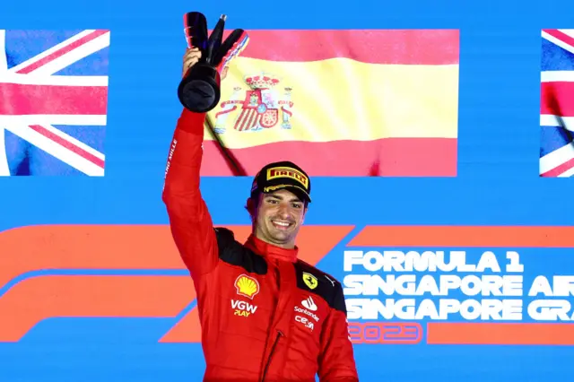 Carlos Sainz celebrates on the podium