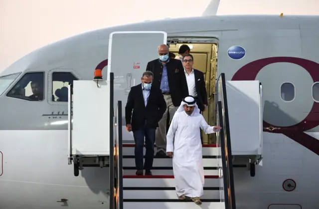 Emad Shargi, Morad Tahbaz and Siamak Namazi being escorted off a plane