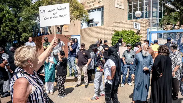 Residents protest outside the offices of Johannesburg Water's Southdale Depot in the south of Johannesburg on March 22, 2023, on World Water Day. - Fuming residents resorted to protesting after being left without water for almost two weeks.