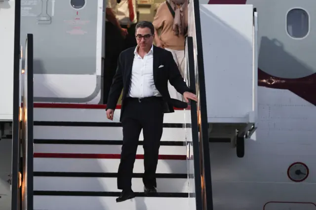 Siamak Namazi walking off the plane