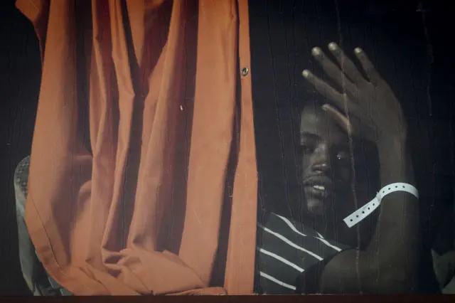 A young man in a coach travelling from Lampedusa to the mainline on 17 September.