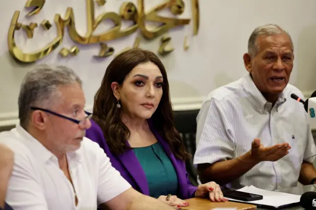 Egyptian politicians Akmal Kortam, Gamila Ismail and Mohamed al-Sadat attend a press conference of executives of the Free Current Movement in Cairo on August 28, 2023, as they respond to the detention of Hisham Kassem.