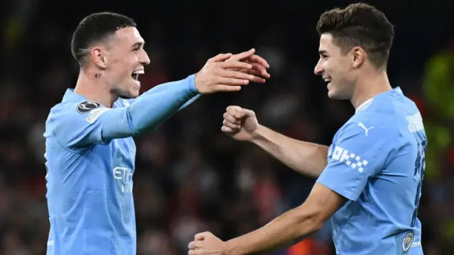 Phil Foden and Julian Alvarez celebrate for Manchester City