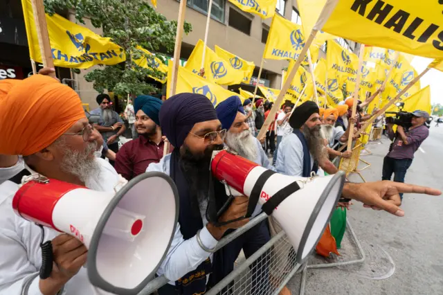 Sikh separatists with flags and loudspeakers protest for the creation of Khalistan in front of the Indian Consulate in Toronto, Canada, on 8 July 2023.