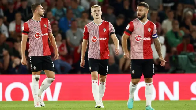 Three Southampton players walking