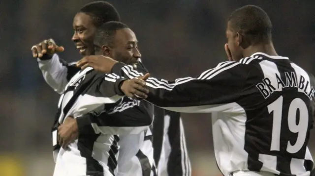 Lomana Tresor Lua Lua celebrates with team-mates