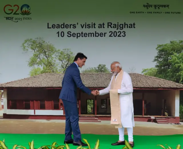 A handout photo made available by the Indian Press Information Bureau (PIB) shows Indian Prime Minister Narendra Modi (R) welcoming Canadian Prime Minsiter Justin Trudeau upon his arrival at the Mahatma Gandhi memorial in Rajghat, New Delhi, India, 10 September 2023