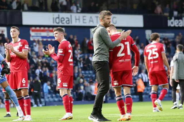 Michael Carrick and the Middlesbrough players applaud the fans