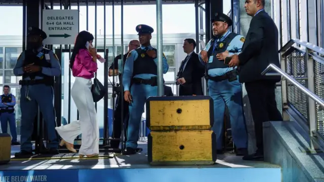 UN security officers stand guard at a delegate entrance during the 78th United Nations General Assembly