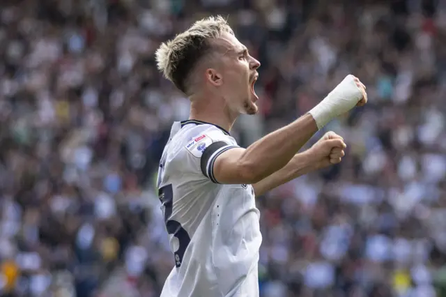 Liam Millar celebrates scoring for Preston NE