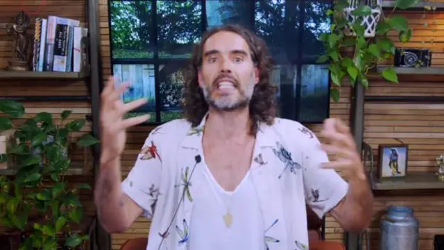 Russell Brand speaking on a YouTube video