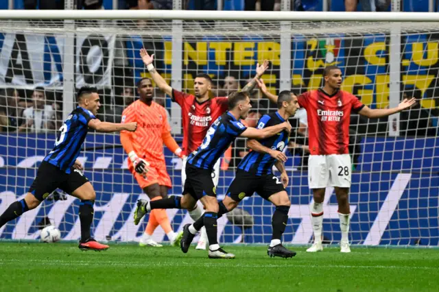 Inter Milan celebrate scoring against AC Milan