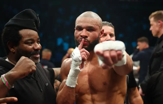 Chris Eubank Jr brings his finger to his mouth to shush