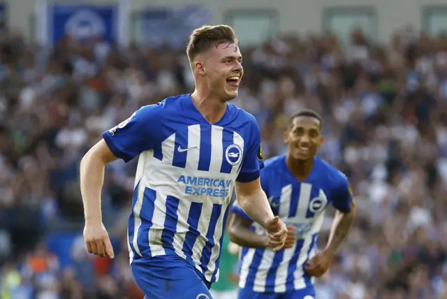 Evan Ferguson smiles and runs to celebrate his second goal.