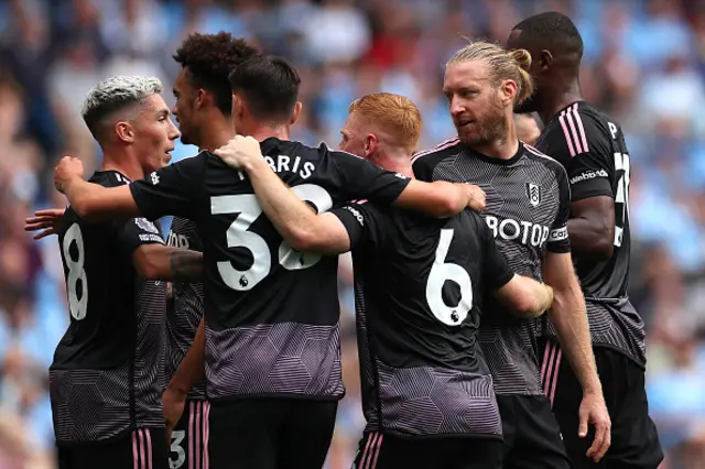 Tim Ream of Fulham celebrates with teammates