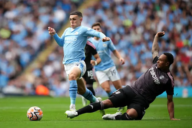 Phil Foden attempts to take it past Kenny Tete