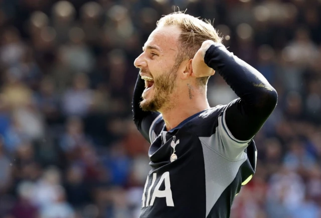 James Maddison cups his ears celebrating