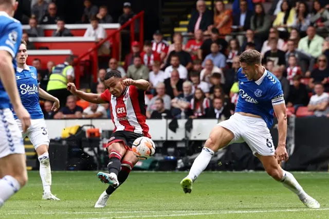 Cameron Archer shoots on the edge of the box as James Tarkowski attempts to block it