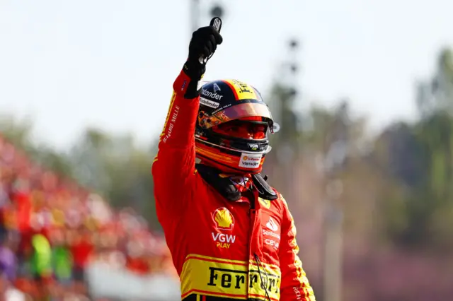 Carlos Sainz celebrates taking pole position at Monza