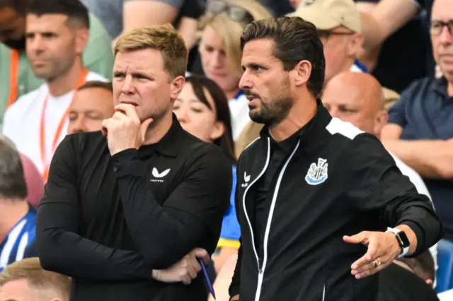 Eddie Howe chats with assistant Jason Tindall.